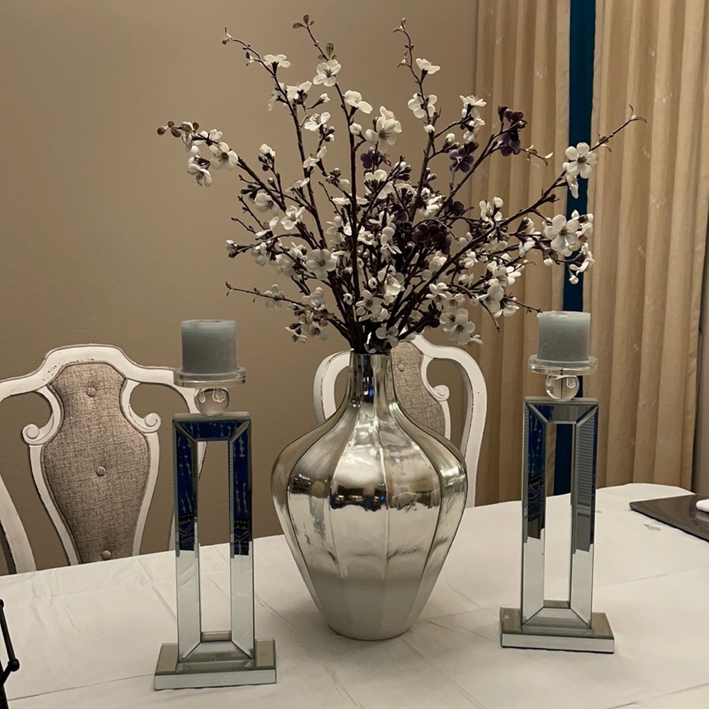 Beautiful vase with flowers, with candle holders